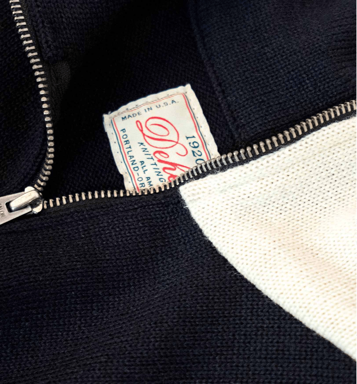 Image showing the DE-SW0056-BLK/WHT - 1/4 Zip Moto-Jersey - Black / Off White which is a Knitwear described by the following info Bargain, Dehen 1920, Knitwear, Released, Tops and sold on the IRON HEART GERMANY online store