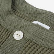Image showing the IHTL-1213-OLV - Waffle Knit Long Sleeved Thermal Henley Olive which is a T-Shirts described by the following info Back In, Iron Heart, Released, T-Shirts, Tops and sold on the IRON HEART GERMANY online store