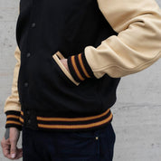 Image showing the DE-JA0002-BLK/PAL - Dehen 1920 x IH Germany Custom Varsity Jacket - Black/Palomino which is a Jackets described by the following info Dehen 1920, Jackets, Released, Tops and sold on the IRON HEART GERMANY online store