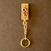 Image showing the Peanuts & Co SNAKE CLIP TYPE KEYCHAIN - Brass which is a Others described by the following info Accessories, Others, Peanuts & Co, Released and sold on the IRON HEART GERMANY online store