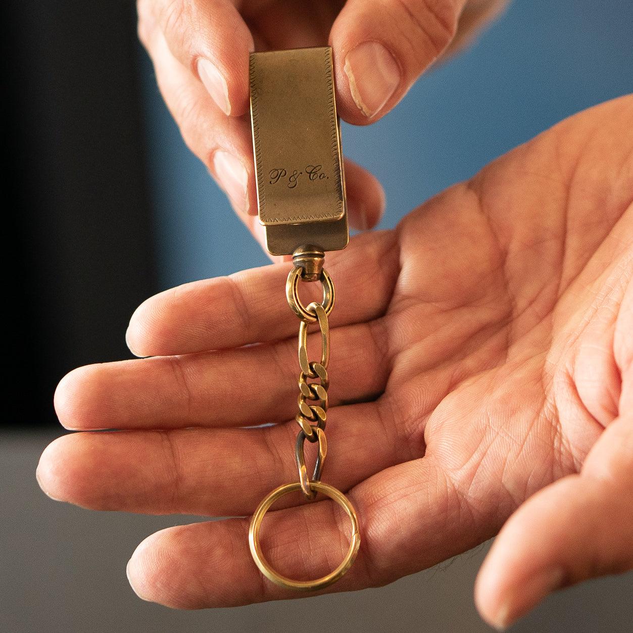 Image showing the Peanuts & Co SNAKE CLIP TYPE KEYCHAIN - Brass which is a Others described by the following info Accessories, Others, Peanuts & Co, Released and sold on the IRON HEART GERMANY online store
