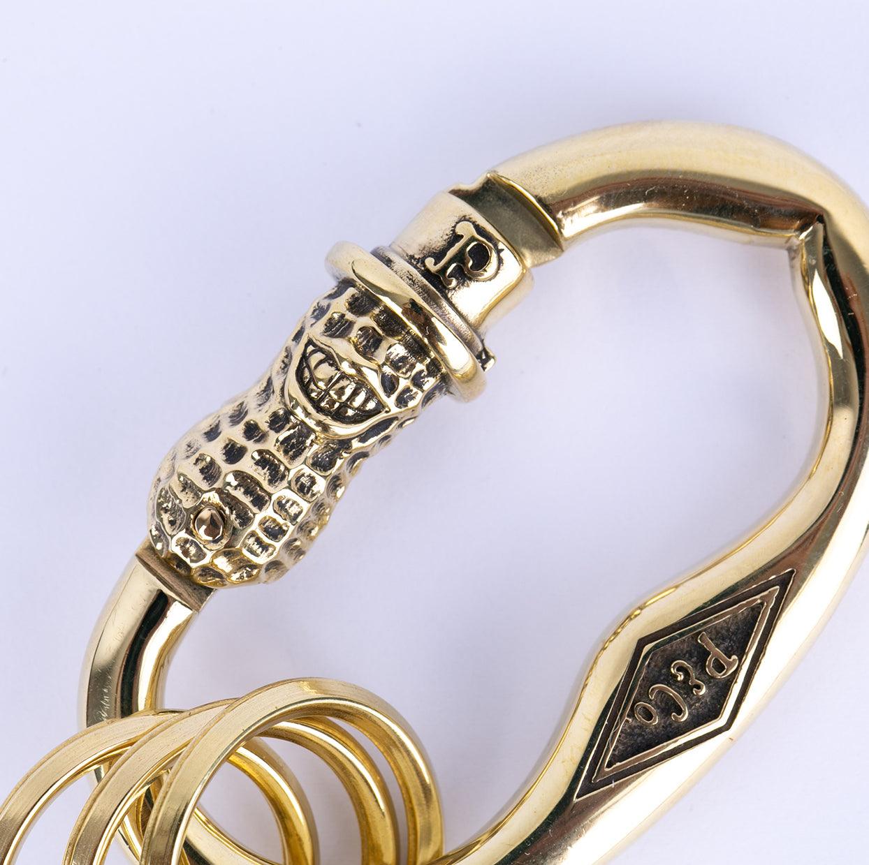 Image showing the Peanuts & Co PEANUTS CARABINER- Brass which is a Others described by the following info Accessories, Others, Peanuts & Co, Released and sold on the IRON HEART GERMANY online store