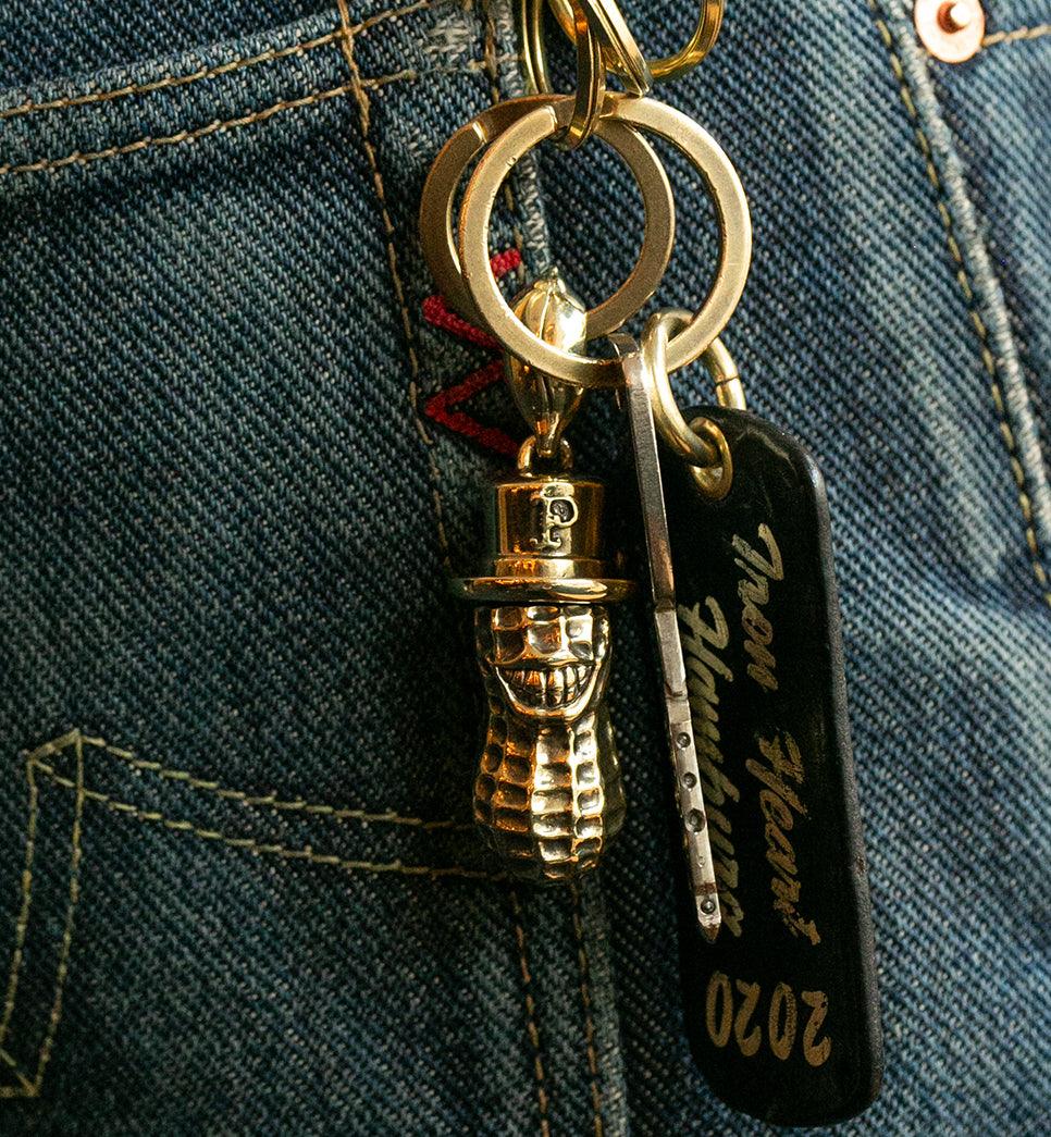 Image showing the Peanuts & Co YACHIMATA PEANUTS key ring pendant - Brass which is a Others described by the following info Accessories, Others, Peanuts & Co, Released and sold on the IRON HEART GERMANY online store