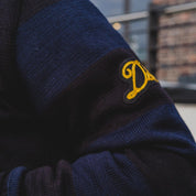 Image showing the DE-IHH-Custom-BLK - 1/4 Zip Moto-Jersey Hamburg - Black/ D.Navy which is a Knitwear described by the following info Dehen 1920, IHSALE_M23, Knitwear, Released, Tops and sold on the IRON HEART GERMANY online store